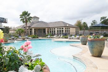 Resort-inspired swimming pool with tanning deck